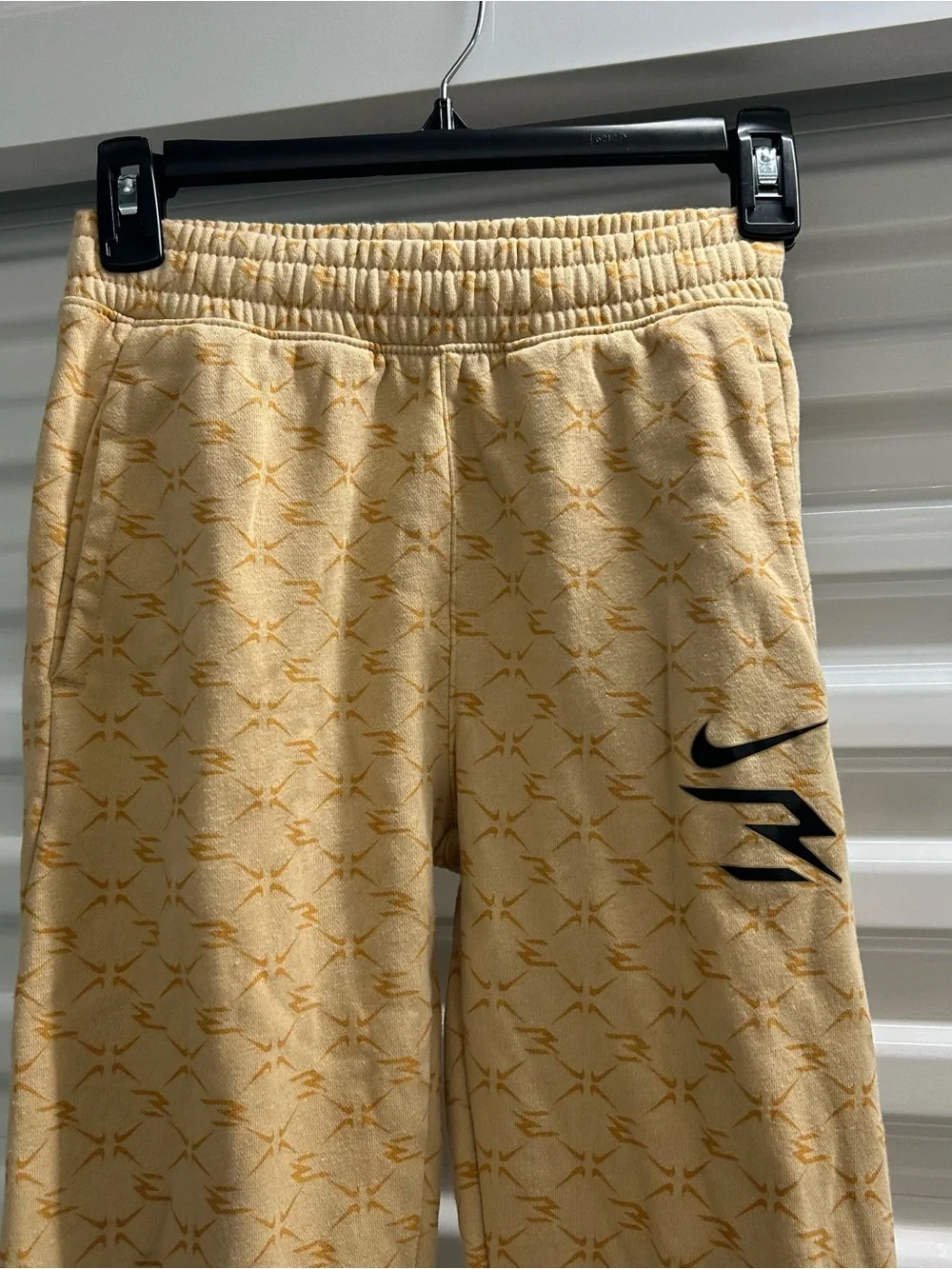 Nike Youth Light Yellow Patterned Joggers with Black Swoosh